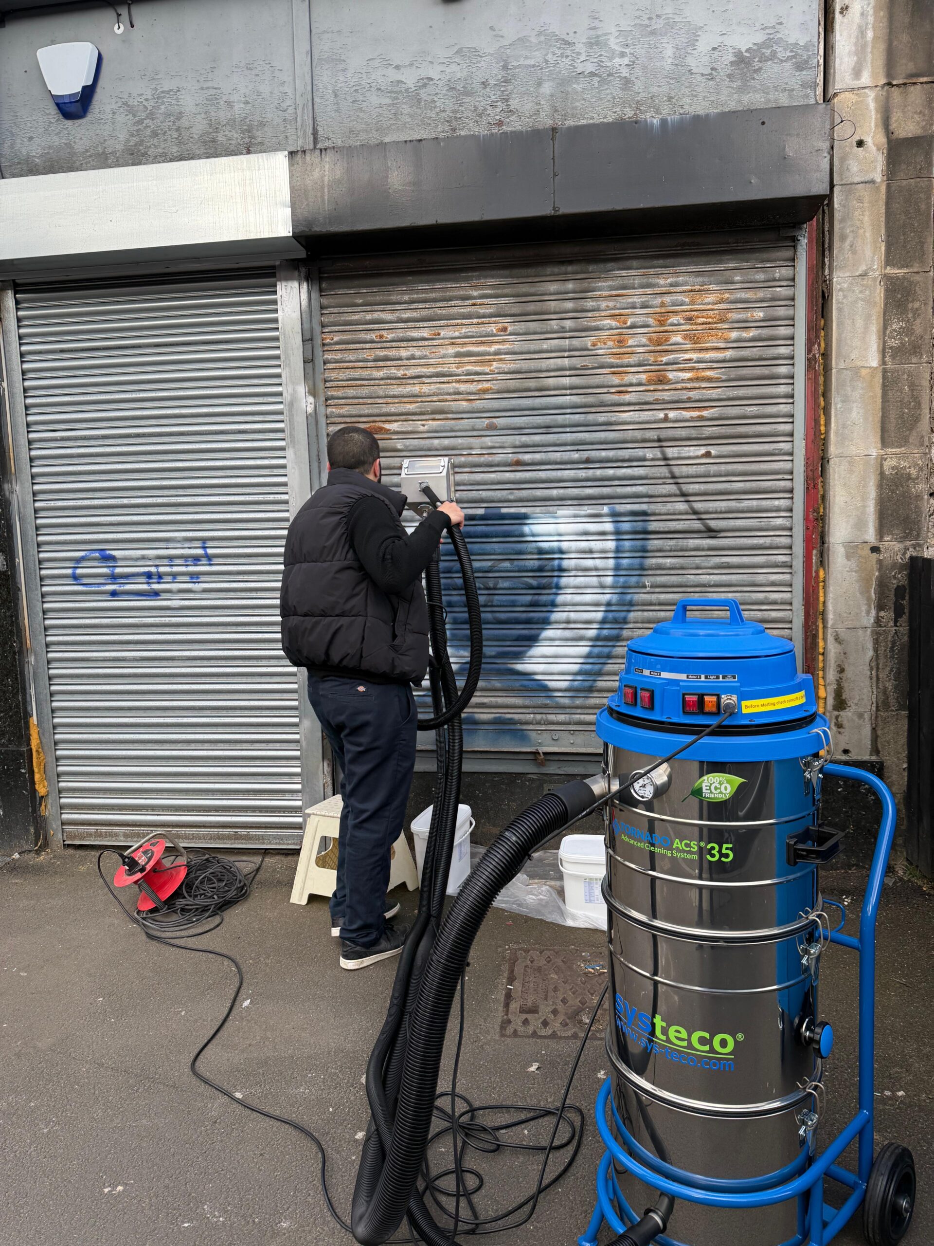 Titus Maintenance vacuum blasting graffiti removal system